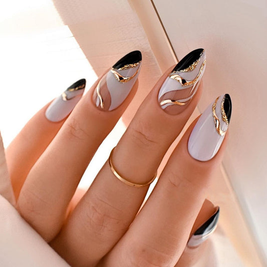 Manicura francesa en forma de almendra, color mandarín con ondas doradas - Uñas removibles